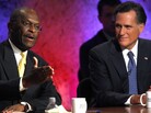 Business executive Herman Cain, left, and former Massachusetts Gov. Mitt Romney during a debate Tuesday (Oct. 11, 2011) in New Hampshire. Business executive Herman Cain, left, and former Massachusetts Gov. Mitt Romney during a debate Tuesday (Oct. 11, 2011) in New Hampshire.