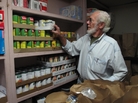 Volunteer Dean Ford prepares bags of food to be distributed at the First Baptist Spartanburg's food pantry program. Volunteer Dean Ford prepares bags of food to be distributed at the First Baptist Spartanburg's food pantry program.
