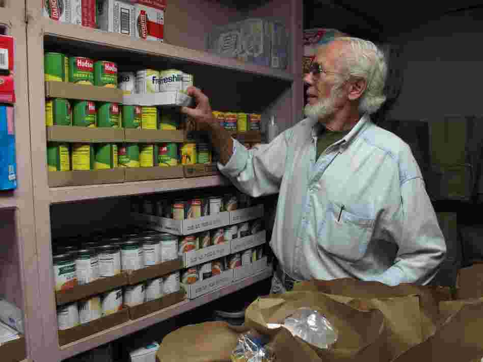 Volunteer Dean Ford prepares bags of food to be distributed at the First Baptist Spartanburg's food pantry program. 