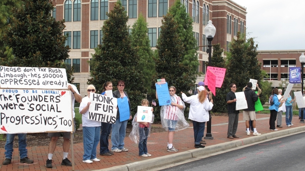  The Occupy Wall Street protests spread Thursday to Spartanburg, S.C. About 20 people got some honks of support and some catcalls from people who shouted, "Get a job!" 