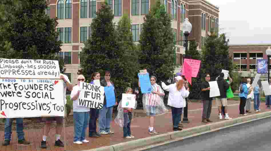  The Occupy Wall Street protests spread Thursday to Spartanburg, S.C. About 20 people got some honks of support and some catcalls from people who shouted, "Get a job!" 