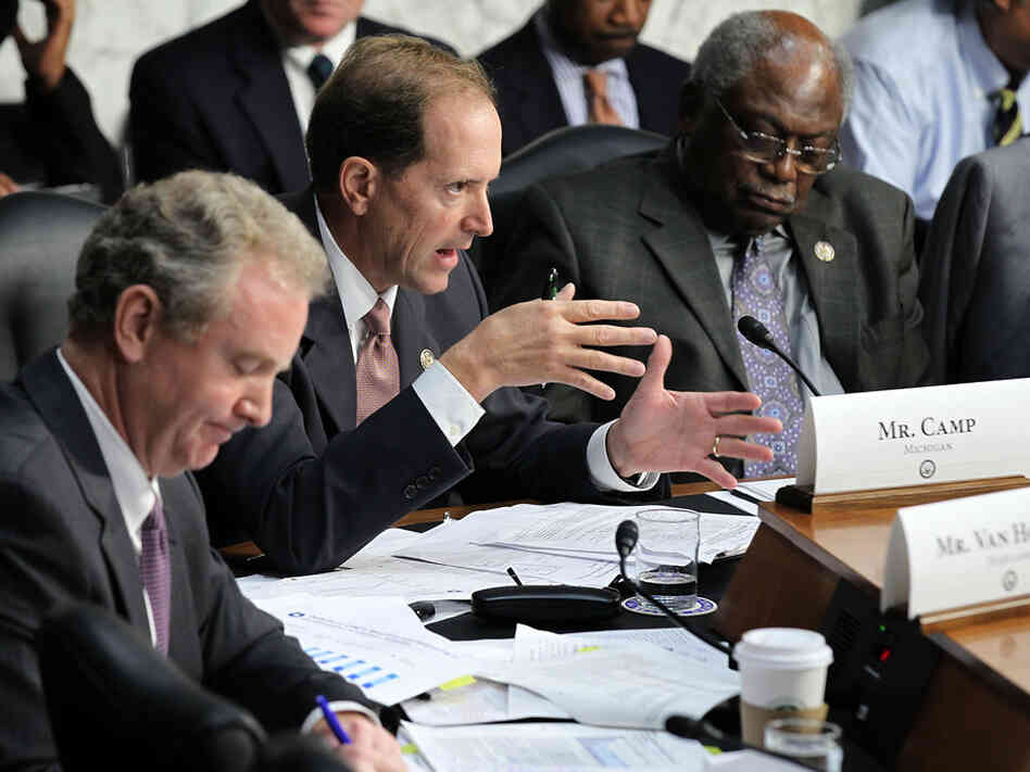U.S. Rep. Dave Camp (R-MI) speaks as Rep. Chris Van Hollen (D-MD) and Rep. Jim Clyburn (D-SC) listen during a hearing before the Joint Deficit Reduction Committee, also known as the supercommittee. U.S. Rep. Dave Camp (R-MI) speaks as Rep. Chris Van Hollen (D-MD) and Rep. Jim Clyburn (D-SC) listen during a hearing before the Joint Deficit Reduction Committee, also known as the supercommittee.