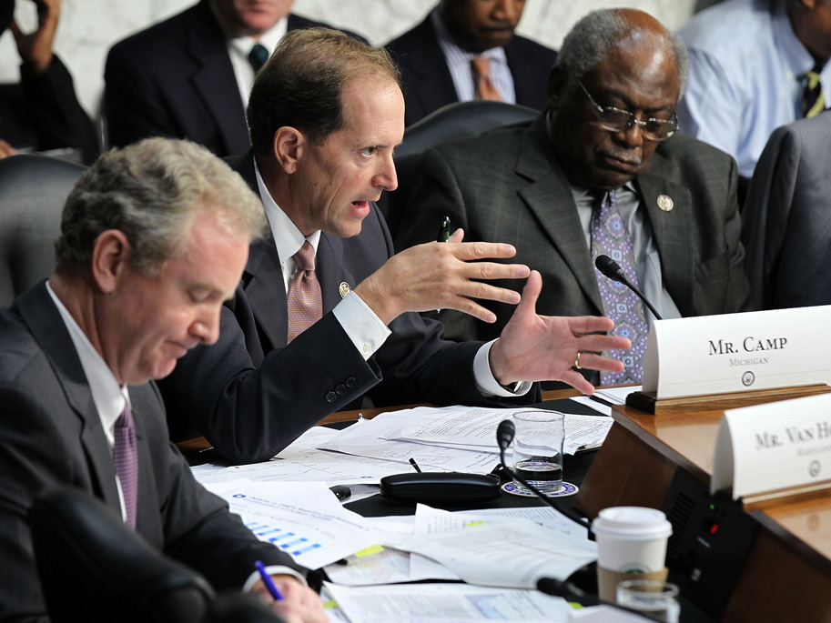 U.S. Rep. Dave Camp (R-MI) speaks as Rep. Chris Van Hollen (D-MD) and Rep. Jim Clyburn (D-SC) listen during a hearing before the Joint Deficit Reduction Committee, also known as the supercommittee. 