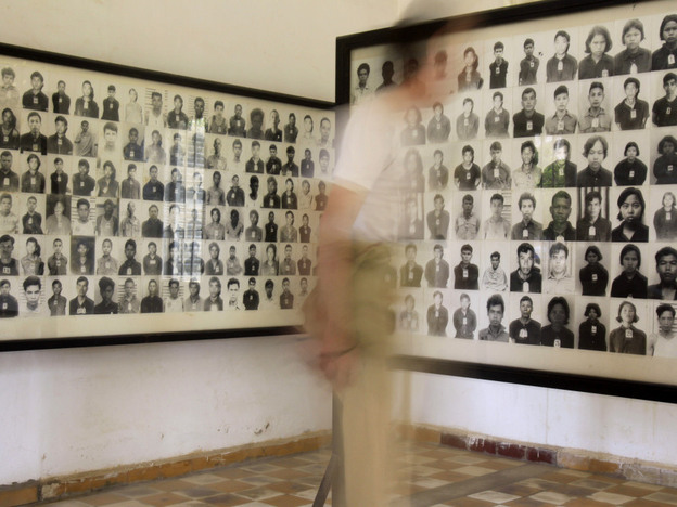 A tourist views photos of former Khmer Rouge prisoners at the Tuol Sleng genocide museum, formerly the regime's notorious S-21 prison, in Phnom Penh, Cambodia, in a photo from 2009. 