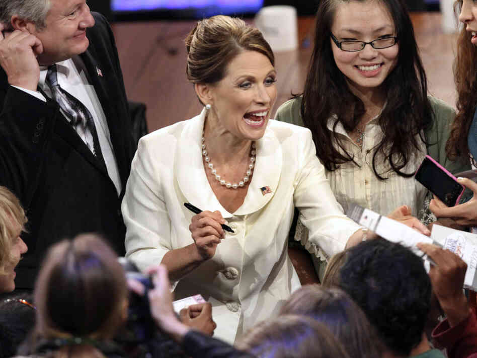 Rep. Michele Bachmann greets supporters after Tuesday's debate in New Hampshire. She saw her political fortunes rise earlier in the summer but has since fallen back in the polls. 