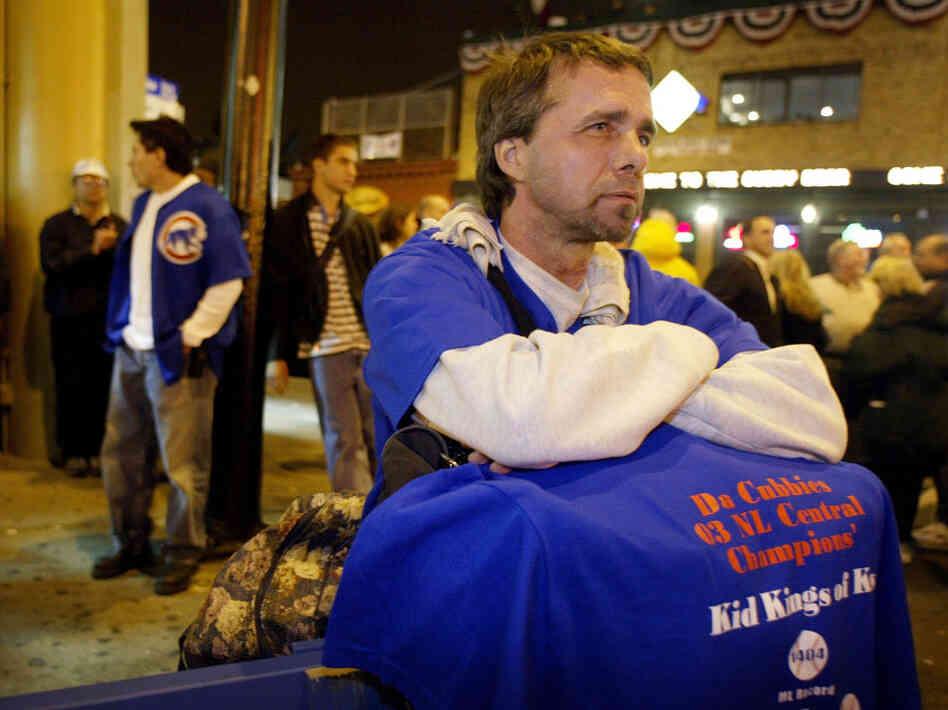 Ted Zegarski and other dejected Cubs fans hang out in front of Wrigley Field as the Chicago Cubs were beaten by the Florida Marlins in Game 7 of the National League Championship Series on Oct. 15, 2003.