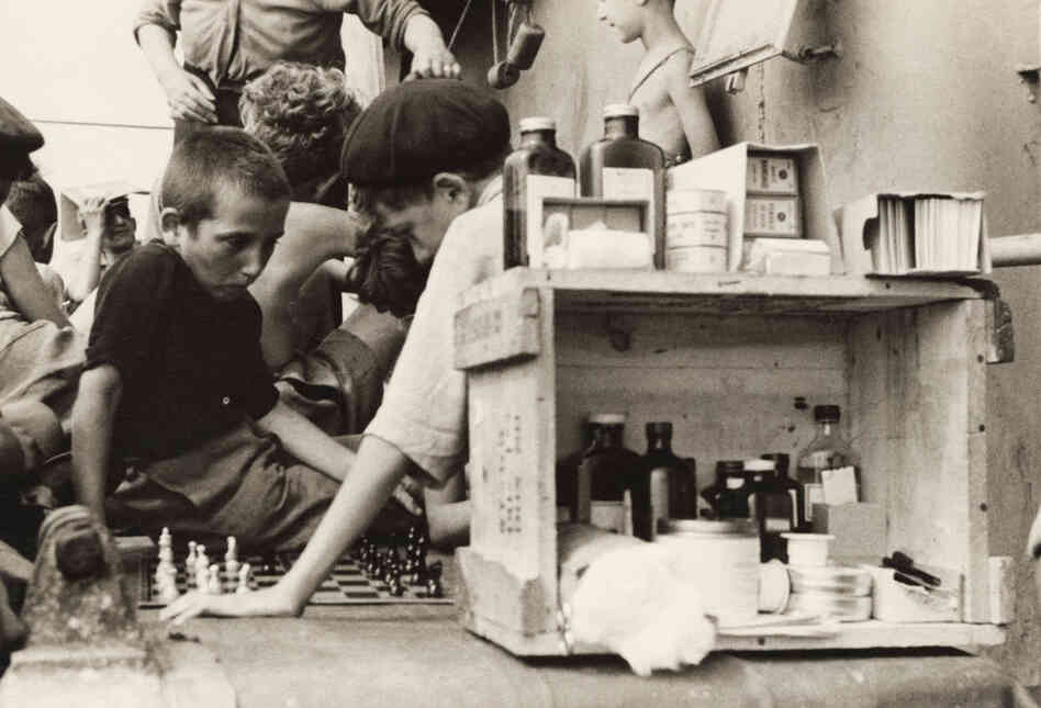 Children playing chess aboard the Henry Gibbins, 1944