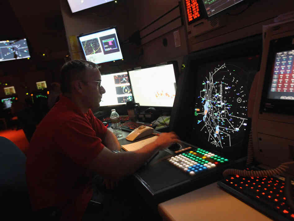 An air traffic controller monitors flights in July at the Denver International Airport. The Federal Aviation Administration is planning to modernize its traffic control system, but has faced a number of obstacles.