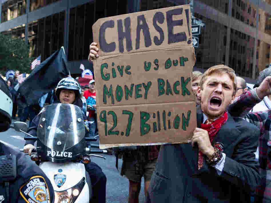 As many as 1,000 Occupy Wall Street protesters marched to a Chase bank in New York's financial district to decry corporate greed.