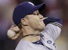 A Phiten necklace flies around the neck of Milwaukee Brewers relief pitcher Chris Narveson as he throws during Game 3 of the National League Championship Series against the St. Louis Cardinals on Wednesday. A Phiten necklace flies around the neck of Milwaukee Brewers relief pitcher Chris Narveson as he throws during Game 3 of the National League Championship Series against the St. Louis Cardinals on Wednesday.