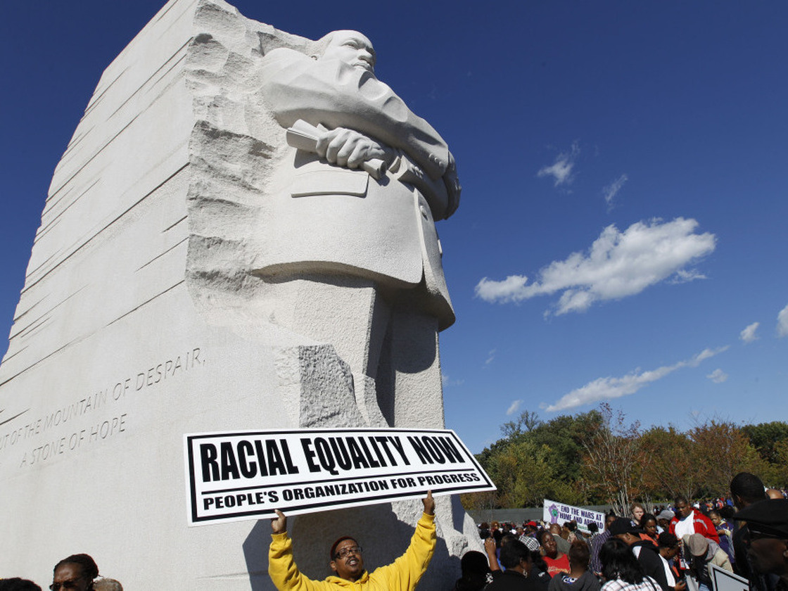 Demonstrators rally under the new Martin Luther King Jr. memorial in Washington, D.C., on Saturday.