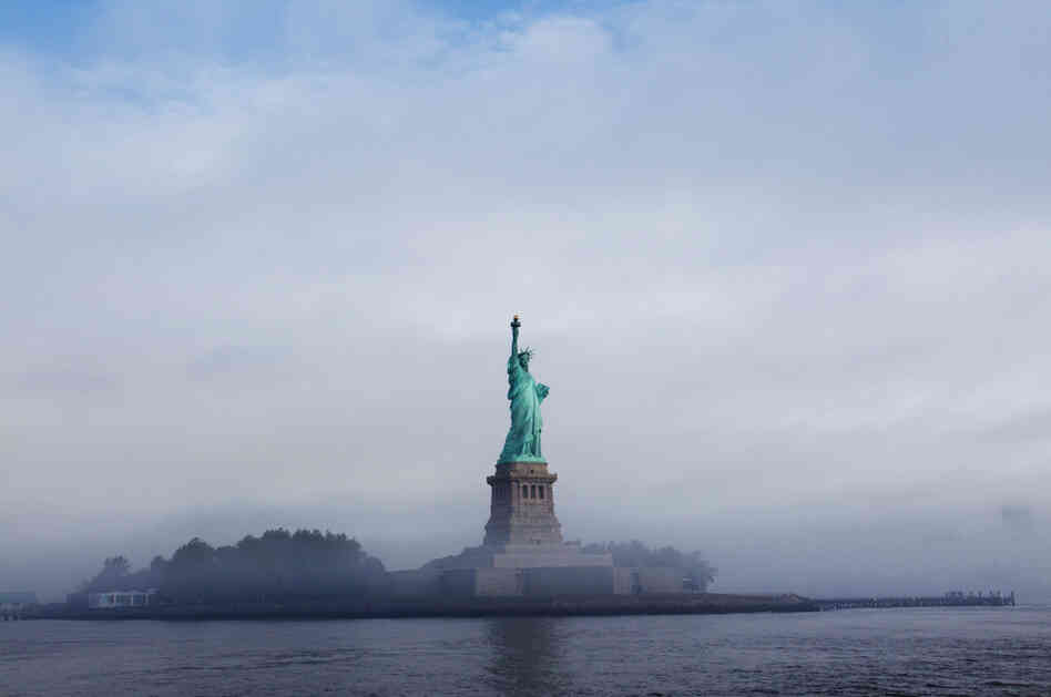 The Statue of Liberty is seen through fog prior to the start of the 125th Anniversary of the Statue of Liberty ceremony on Liberty Island in Sept. 2011. 