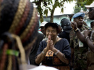 Liberian President Ellen Johnson Sirleaf addresses a crowd of supporters on Saturday outside offices of her party on the outskirts of Monrovia, Liberia's capital. She faces Winston Tubman in a runoff election scheduled for Nov. 8. Liberian President Ellen Johnson Sirleaf addresses a crowd of supporters on Saturday outside offices of her party on the outskirts of Monrovia, Liberia's capital. She faces Winston Tubman in a runoff election scheduled for Nov. 8.