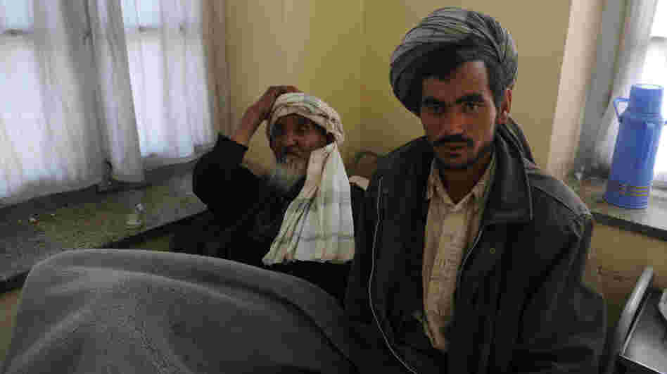 Afghan men wait to receive psychiatric treatment in a Kabul hospital. Scarred by decades of war, social problems and poverty, more than 60 percent of Afghans suffer from stress disorders and mental health problems.