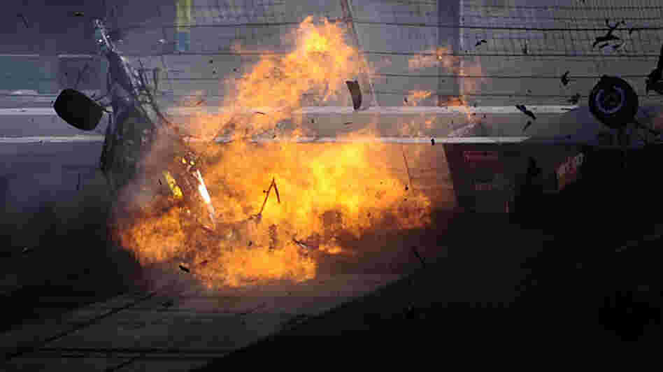 The car of driver Dan Wheldon  bursts into flames during the Las Vegas Indy 300. Wheldon, 33, was killed.