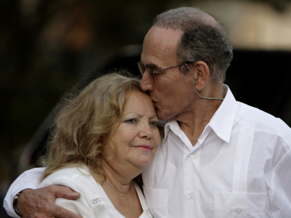 Pollan founded the Ladies in White after her husband, Cuban dissident Hector Maseda, was jailed. He was released in February this year. In this photo from March, Maseda kisses Pollan before a meeting with former U.S. President Jimmy Carter in Havana. 