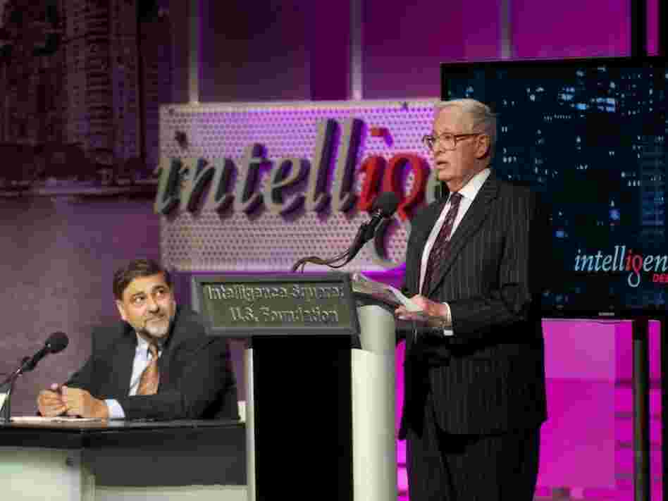  Vivek Wadhwa (left) and Henry Bienen argue against the motion "Too Many Kids Go To College." 