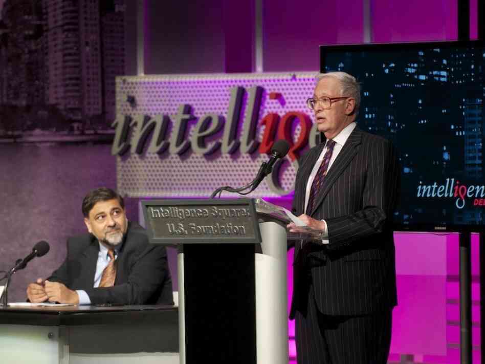  Vivek Wadhwa (left) and Henry Bienen argue against the motion "Too Many Kids Go To College." 