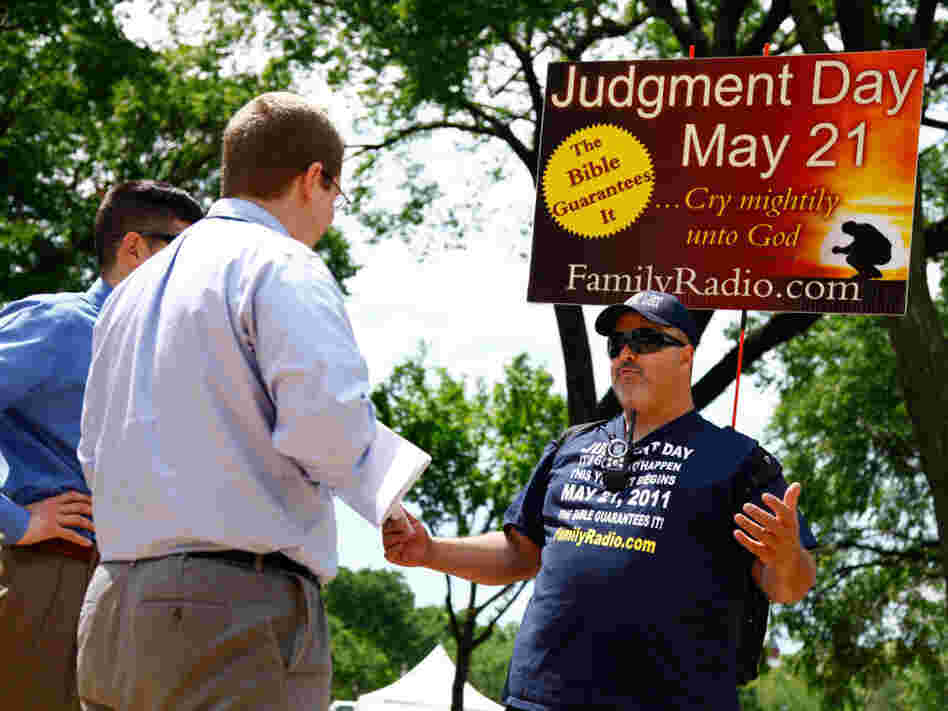 On the National Mall in Washington, D.C., in May, David Liquori (right) talks with passersby. On the National Mall in Washington, D.C., in May, David Liquori (right) talks with passersby.