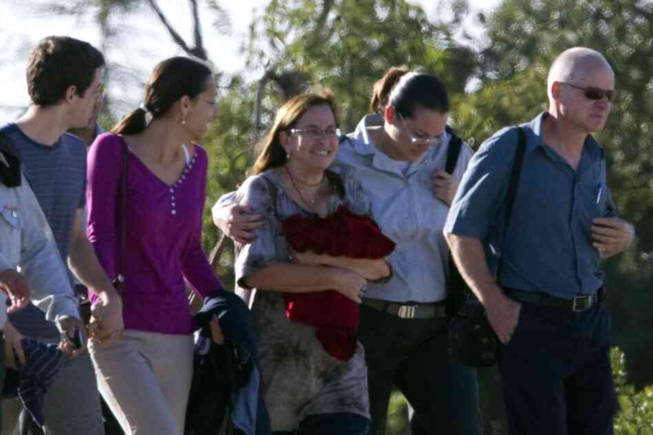 Shalit's parents, Aviva (center) and Noam (right) Shalit, prepare to board a helicopter in their home of Mitzpe Hila to reunite with their son. 