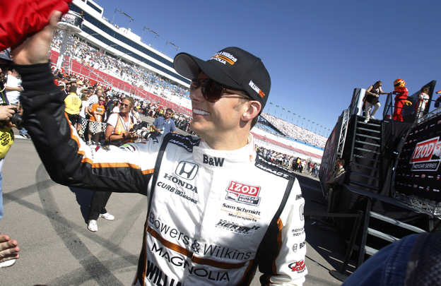 Dan Wheldon, of England, smiles during driver introductions for the IndyCar Series Las Vegas Indy 300 auto race Sunday, Oct. 16, 2011, in Las Vegas. Wheldon, a two-time Indianapolis 500 winner, died following a crash in the race. 