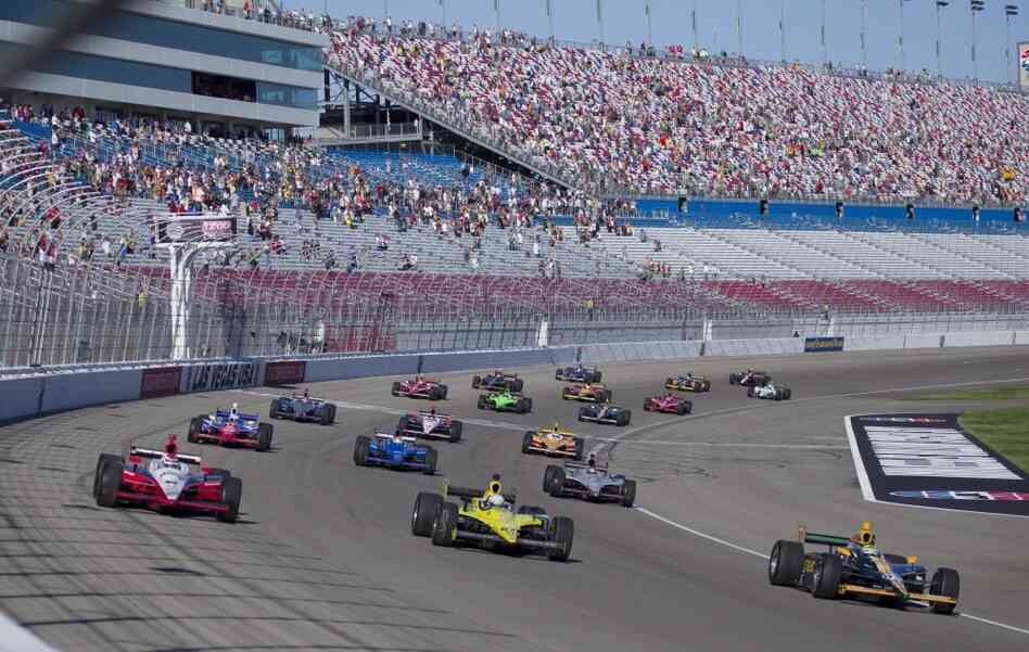 Drivers take five tribute laps in honor of Dan Wheldon, who died following a crash in the IndyCar Series Las Vegas Indy 300 auto race earlier Sunday. The race did not resume. 