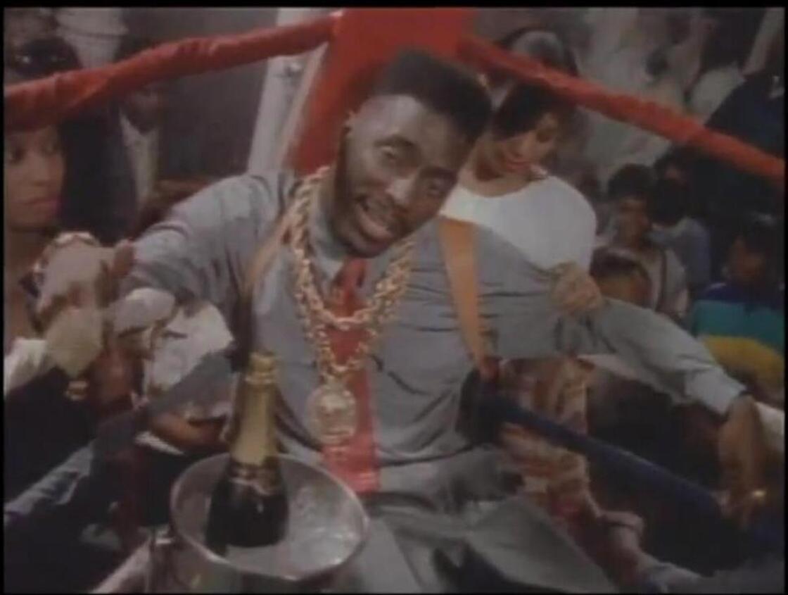 Big Daddy Kane in the ring. In a suit.