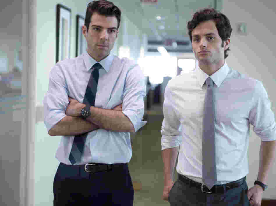 A junior analyst (Zachary Quinto, left) and his colleague (Penn Badgley) find the flaw in the formula that could bring down their company — and the economy.