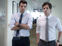 <p><strong></strong>A junior analyst (Zachary Quinto, left) and his colleague (Penn Badgley) find the flaw in the formula that could bring down their company — and the economy.</p>