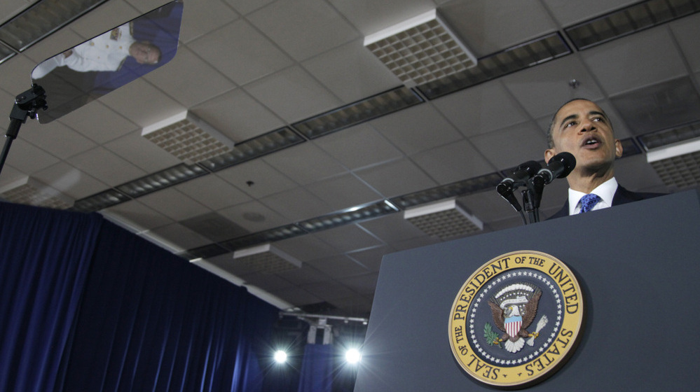 When he addresses crowds, the president often uses a teleprompter (screen at left) and a podium adorned with the presidential seal. Here: an Aug. 5, 2011, event at the Washington Navy Yard.