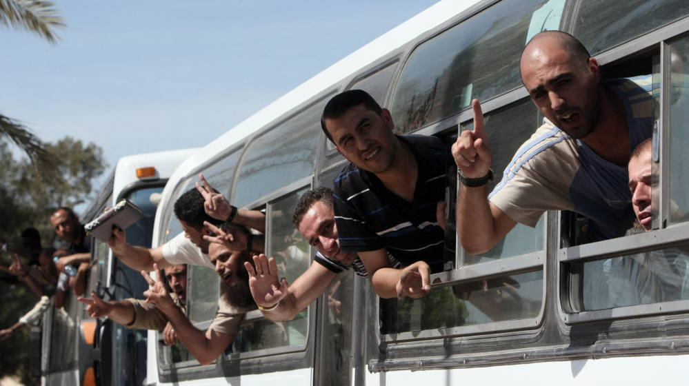 Palestinian prisoners cross to the southern Gaza Strip from the Egyptian side of the Rafah border earlier today (Oct. 18, 2011) following their release from Israeli prisons.