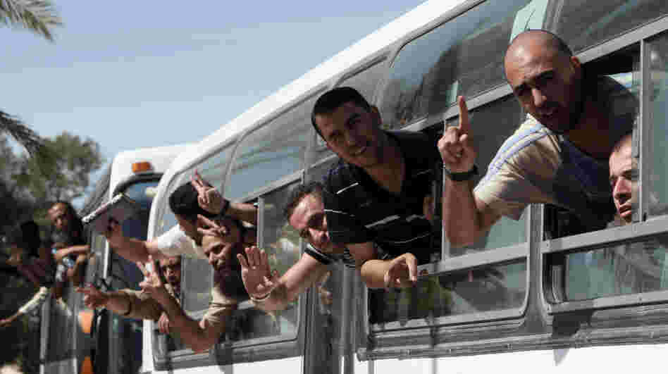 Palestinian prisoners cross to the southern Gaza Strip from the Egyptian side of the Rafah border earlier today (Oct. 18, 2011) following their release from Israeli prisons.