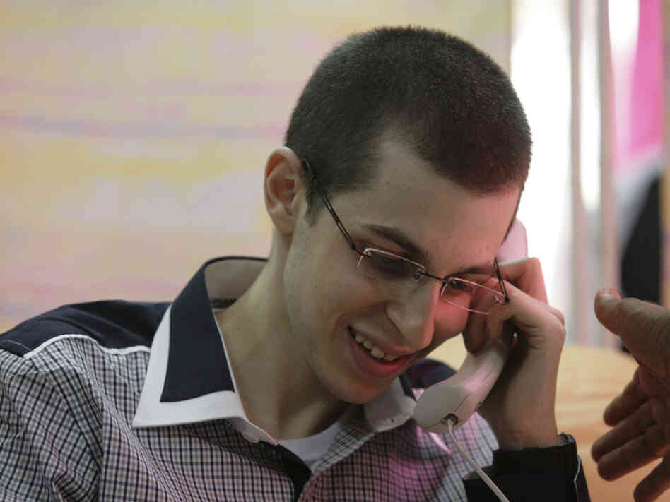 Israeli soldier Gilad Shalit talks to his parents on the phone at an undisclosed location soon after being released from captivity Tuesday.
