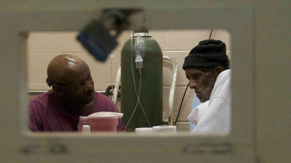 A caretaker and his patient in the documentary Serving Life. 
