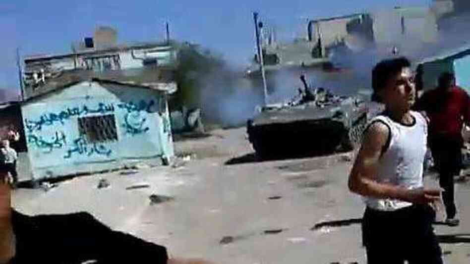 In a frame grab from a YouTube video, Syrian protesters clash with an armored military in the southern Syrian town of Dera'a last Friday, according to people in the video. In a frame grab from a YouTube video, Syrian protesters clash with an armored military in the southern Syrian town of Dera'a last Friday, according to people in the video.