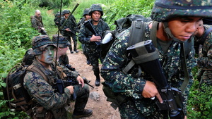 U.S. Marines and their Filipino counterparts take part in a training exercise last year in the Philippines. The U.S. has a history of sending small military contingents abroad.