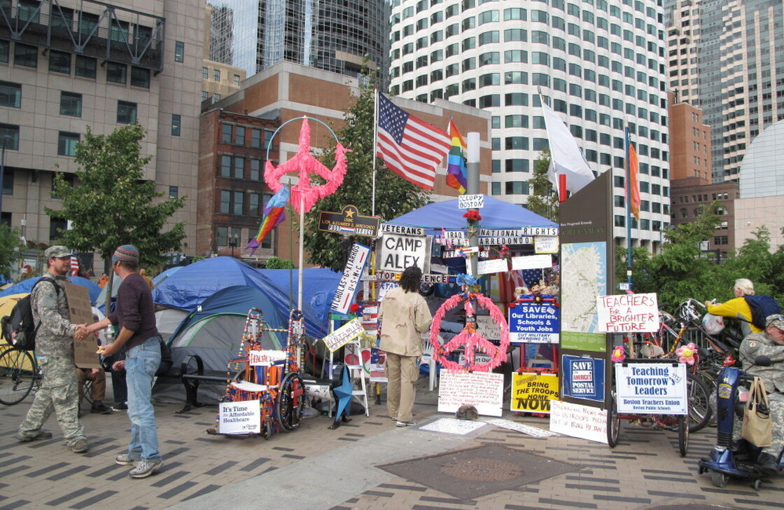Occupy Boston protesters congregate across the street from the Federal Reserve Bank of Boston. 