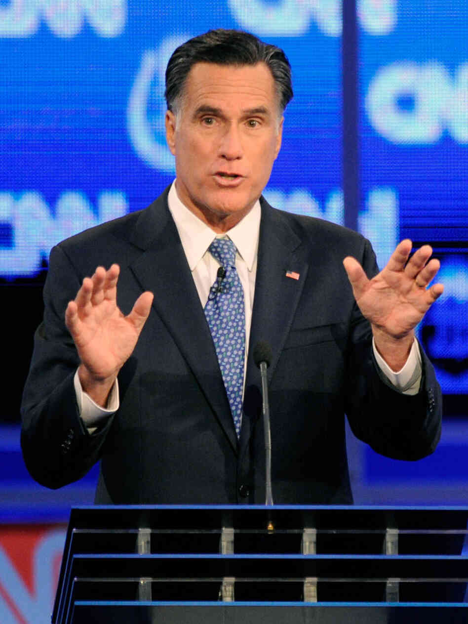 Former Massachusetts Gov. Mitt Romney defended his faith in the Republican presidential debate Tuesday night in Las Vegas. 