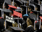 Students attend graduation ceremonies at the University of Alabama in Tuscaloosa, Ala. Two-thirds of college students now graduate with debt, owing an average amount of $24,000. Students attend graduation ceremonies at the University of Alabama in Tuscaloosa, Ala. Two-thirds of college students now graduate with debt, owing an average amount of $24,000.
