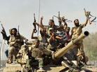 Anti-Gaddafi fighters celebrate the fall of Sirte in the town October 20, 2011. Anti-Gaddafi fighters celebrate the fall of Sirte in the town October 20, 2011.