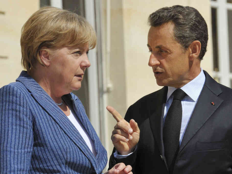 France's President Nicolas Sarkozy, right, speaks to German Chancellor Angela Merkel. France's President Nicolas Sarkozy, right, speaks to German Chancellor Angela Merkel.