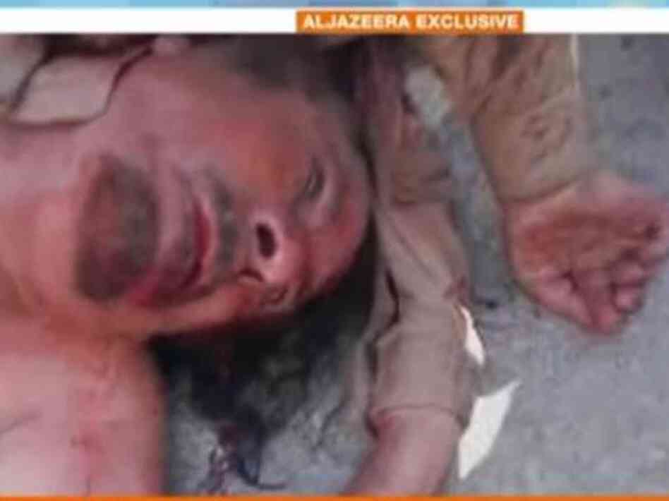 Al-Jazeera English says this image, from a video clip, is of the body of ousted Libyan leader Moammar Gadhafi.