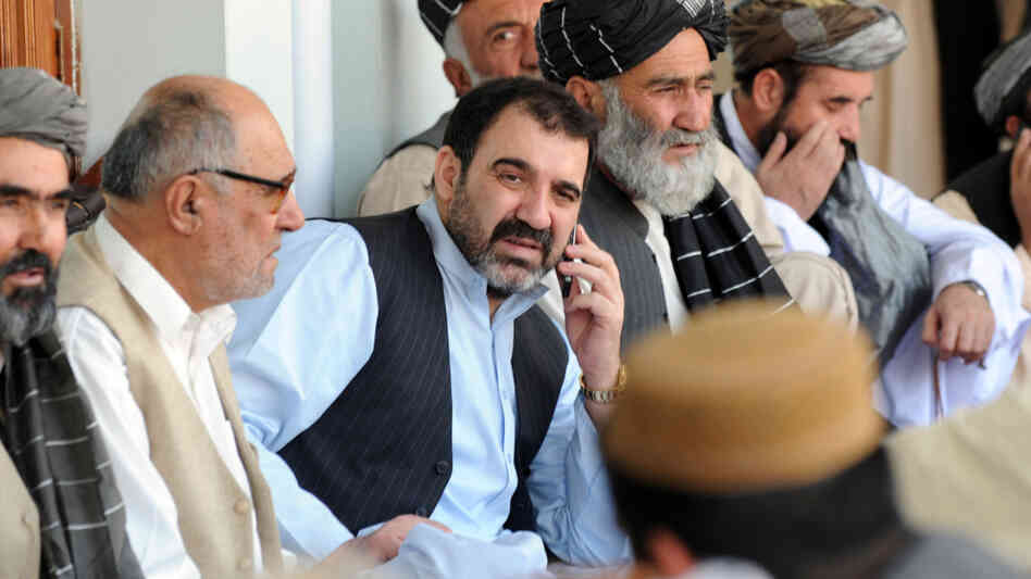 The assassination of Ahmed Wali Karzai (center, shown in 2009), the half-brother of Afghan President Hamid Karzai, prompted fears of a security breakdown in the southern Afghan city of Kandahar. Ahmed Wali Karzai was rumored to have a hand in everything that went on in the region: tribal affairs, politics and business. The assassination of Ahmed Wali Karzai (center, shown in 2009), the half-brother of Afghan President Hamid Karzai, prompted fears of a security breakdown in the southern Afghan city of Kandahar. Ahmed Wali Karzai was rumored to have a hand in everything that went on in the region: tribal affairs, politics and business.