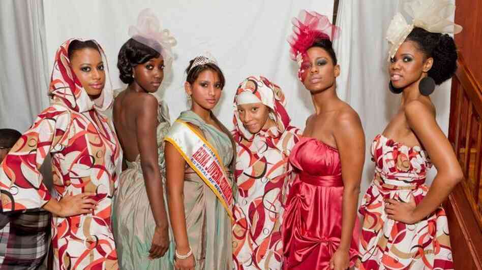 Fashion designer Nailah Lymus (third from right) stands with models wearing her latest collection after a runway show. Fashion designer Nailah Lymus (third from right) stands with models wearing her latest collection after a runway show.