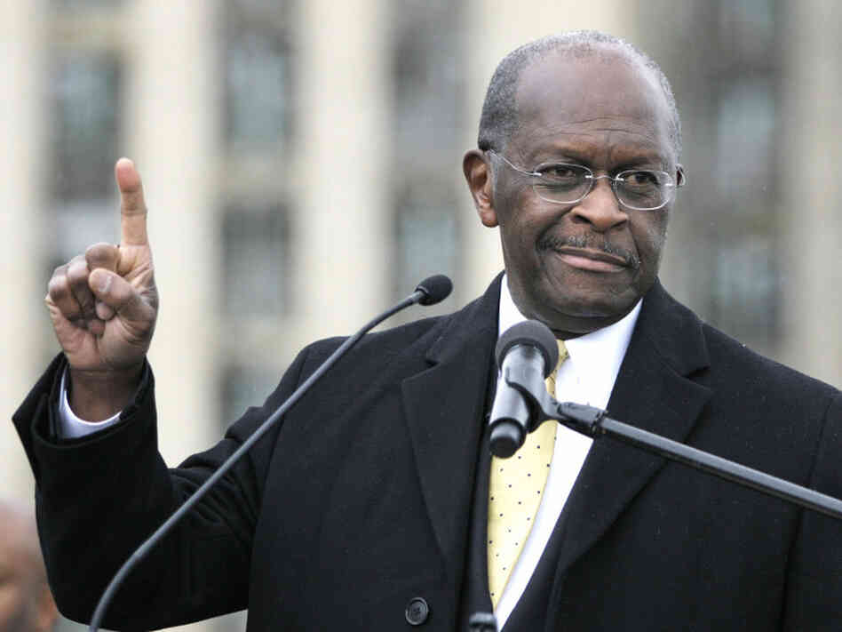 Republican presidential candidate Herman Cain speaks on Friday while unveiling his "Opportunity Zone" economic plan in front of the Michigan Central Station, an abandoned train depot in Detroit.