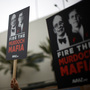 Protesters demonstrate outside the News Corp. annual shareholder meeting at Fox Studios in Los Angeles on Friday. Protesters demonstrate outside the News Corp. annual shareholder meeting at Fox Studios in Los Angeles on Friday.