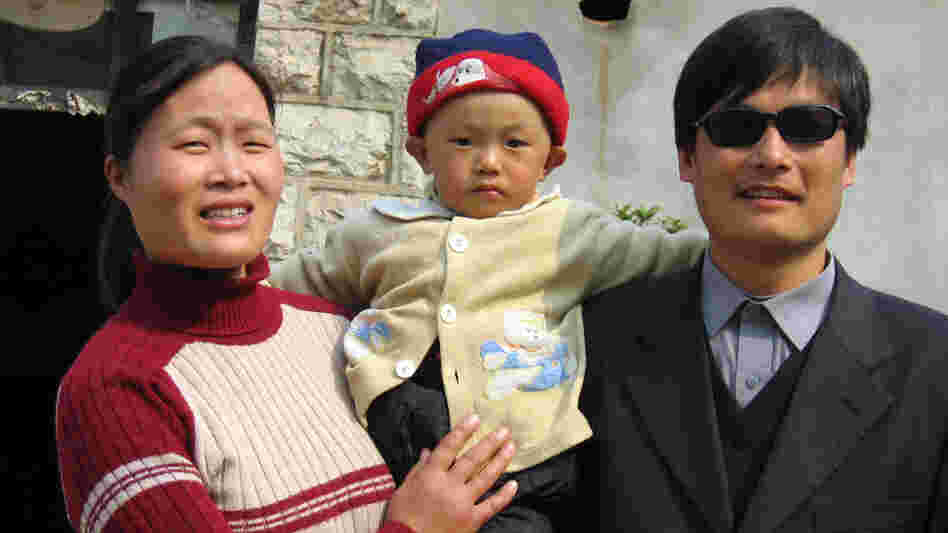 Blind activist Chen Guangcheng with his wife and son outside their home in northeast China's Shandong province in 2005. He's been held incommunicado at his home for more than a year and has become the focus of a microblog campaign by human-rights activists. 
