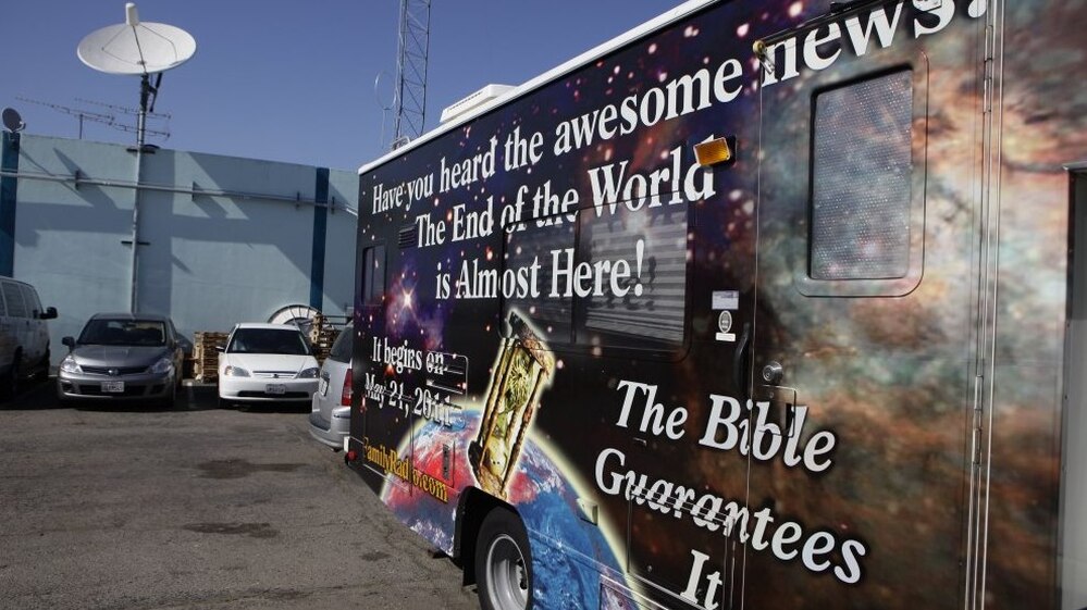 A sign on an RV announces the end of the world, outside Harold Camping's ministry in Oakland, Calif., Monday, May 23, 2011. Ahead of that day, many of Camping's followers had quit their jobs or donated money to pay for more than 5,000 billboards and 20 RVs plastered with the Judgment Day message.