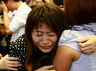 An image from the Twitter-like Chinese site Weibo.com shows a composite image of the toddler's mother, Qu Feifei (left); her rescuer, Chen Xianmei (top right) and Wang Yue. An image from the Twitter-like Chinese site Weibo.com shows a composite image of the toddler's mother, Qu Feifei (left); her rescuer, Chen Xianmei (top right) and Wang Yue.
