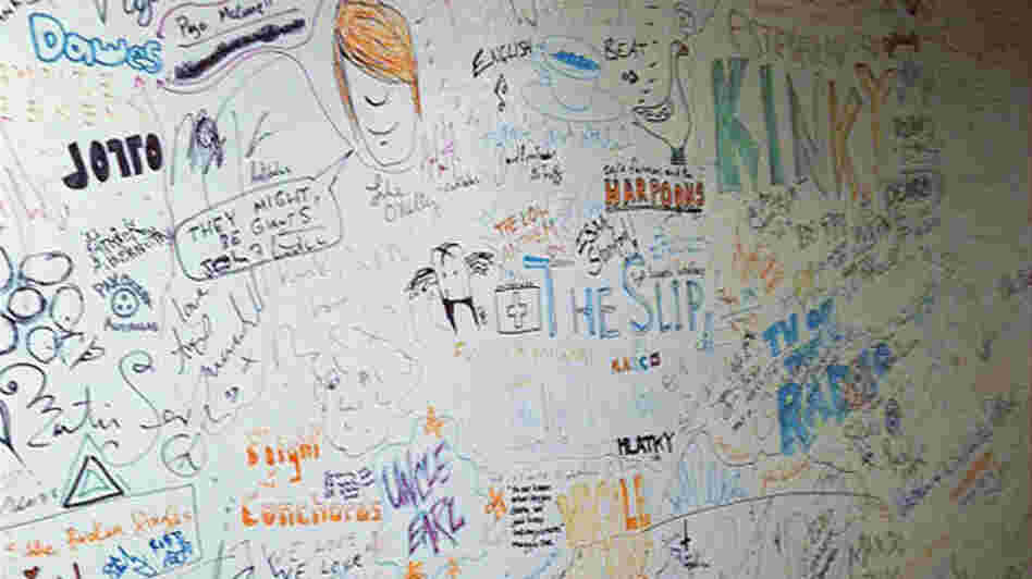 The famed World Cafe signature wall, where every guest leaves a mark on the studio. Spot anyone you recognize?
